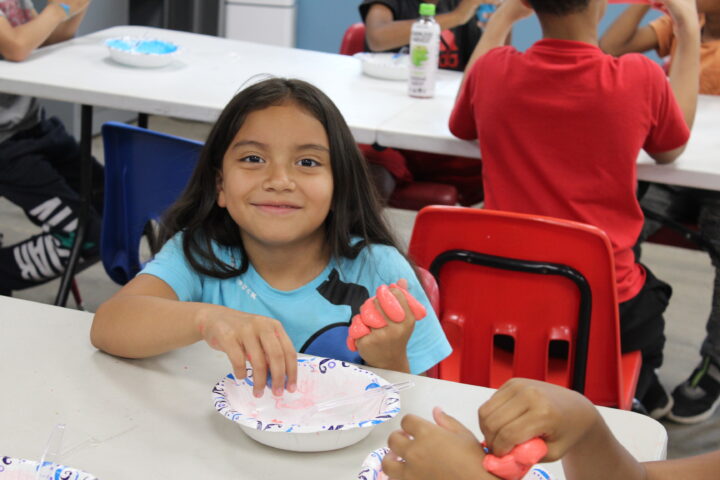 girl playing with play dough